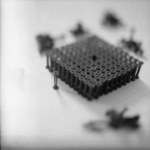 <body>
<p>This work was initially conceived of as a nod to the Terracotta Army of the Qin Emperor. Seeing that the film size ‘120’ for which these spools were manufactured is numerically 11²-1, I arranged this as a phalanx of 11 ranks of 11 and left the centre element out.</p>
<p>I thought I could also look at this omission as a flaw in the lattice and to see how the structure behaved over time, perhaps to model the corruption of power while I worked on the Dissent project with Chapel Arts. </p>
</body>
 Images Copyright Aldobranti® ©2008-'2025. All rights reserved.